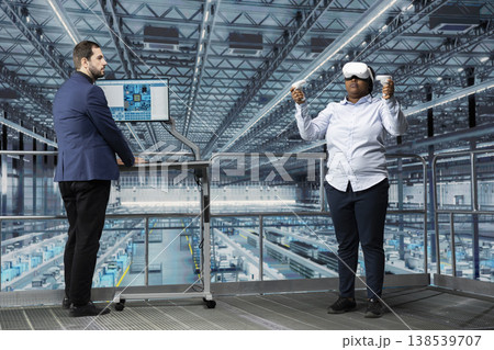 Using VR headset gear, microchip and woman in smart factory managing resource allocation. Analyzing semiconductor plant operations efficiency, virtual reality simulation and engineering team Using VR headset gear, microchip and woman in smart factory managing resource allocation. Analyzing semiconductor plant operations efficiency, virtual reality simulation and engineering team 138539707