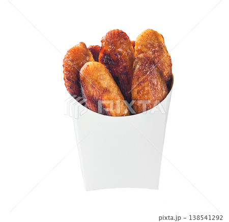 fried chicken wings in a paper bucket isolated on white background. fried chicken wings in a paper bucket isolated on white background. 138541292