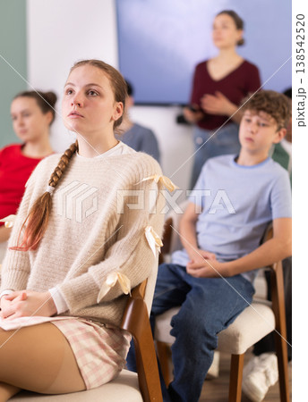 European teenage girl is sitting in a school classroom European teenage girl is sitting in a school classroom 138542520