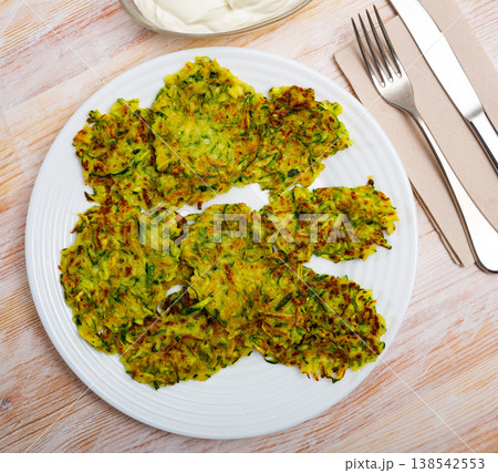 Fried zucchini fritters Fried zucchini fritters 138542553