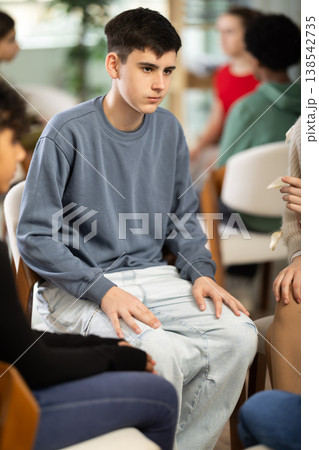 Teenage boy participating in group communication Teenage boy participating in group communication 138542735