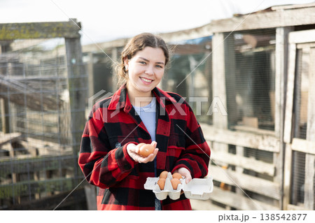 Young woman with chicken eggs in hen house Young woman with chicken eggs in hen house 138542877