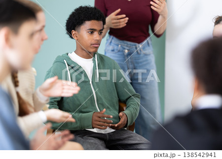 Teenage boy participating in group communication 138542941