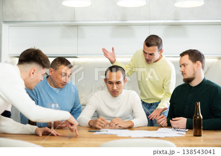 Friends comforting upset man receiving unpleasant news Friends comforting upset man receiving unpleasant news 138543041