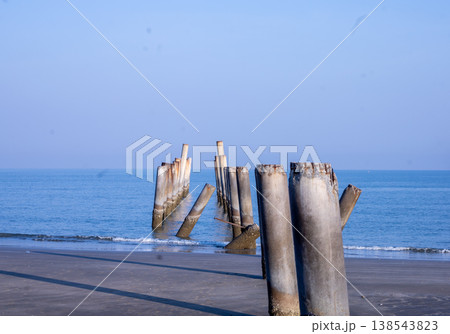 The Leaning pole at Sao Aiang Beach- Derelict concrete pier posts in the seaOld concrete pillars from an abandoned fishing pier, sticking out of the sea The Leaning pole at Sao Aiang Beach- Derelict concrete pier posts in the seaOld concrete pillars from an abandoned fishing pier, sticking out of the sea 138543823