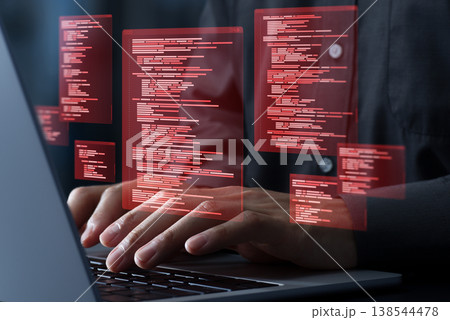 ソースコードの脆弱性を悪用してサイバー攻撃を仕掛けるハッカー。ハッキングおよびサイバー犯罪のコンセプ ソースコードの脆弱性を悪用してサイバー攻撃を仕掛けるハッカー。ハッキングおよびサイバー犯罪のコンセプ 138544478