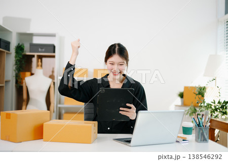 Small business entrepreneur SME freelance woman working at home office, BOX,tablet and laptop online, marketing, packaging, delivery,  e-commerce concept 138546292