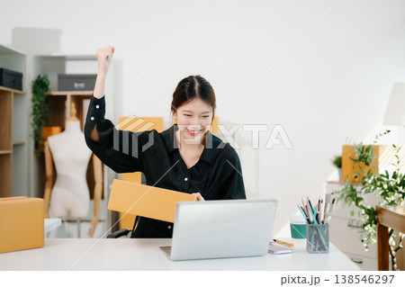 Small business entrepreneur SME freelance woman working at home office, BOX,tablet and laptop online, marketing, packaging, delivery, e-commerce concept Small business entrepreneur SME freelance woman working at home office, BOX,tablet and laptop online, marketing, packaging, delivery, e-commerce concept 138546297