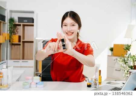 Asian beauty influencer reviewing lipstick and cosmetics on camera for online marketing and ecommerce, reflecting modern lifestyle content creation Asian beauty influencer reviewing lipstick and cosmetics on camera for online marketing and ecommerce, reflecting modern lifestyle content creation 138546362