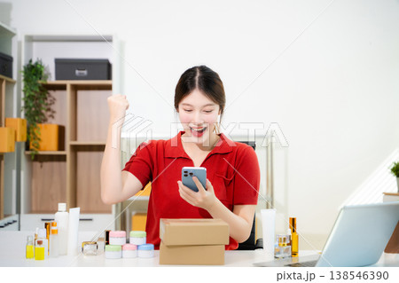 Startup small business SME, Entrepreneur owner woman using smartphone or tablet taking receive and checking online purchase shopping order Startup small business SME, Entrepreneur owner woman using smartphone or tablet taking receive and checking online purchase shopping order 138546390