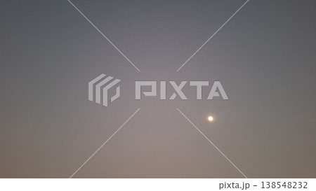 Full Moon Shining Through Hazy Dusk Sky with Minimalist Soft Gradient Background 138548232
