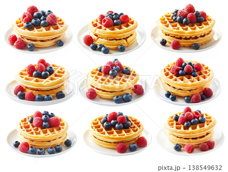 Stack of golden waffles topped with raspberries and blueberries, isolated on white background, concept of breakfast Stack of golden waffles topped with raspberries and blueberries, isolated on white background, concept of breakfast 138549632
