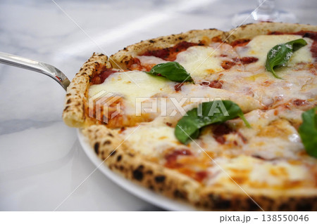 Delicious Hot Margherita Pizza on White Plate with Marble Background 138550046