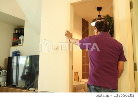 Senior Man at Bathroom Doorway Senior Man at Bathroom Doorway 138550102