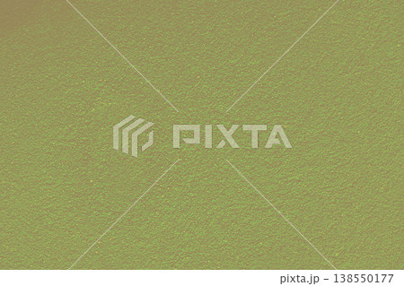 Green grain on dark yellow freshly plastered wall 138550177
