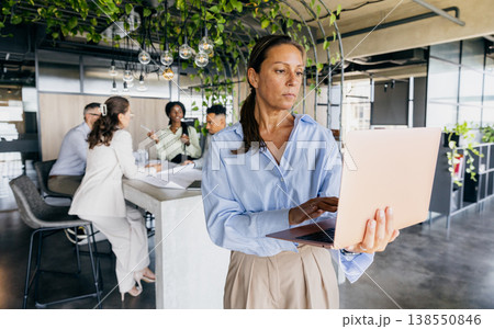 Female executive pausing for reflection in startup office Female executive pausing for reflection in startup office 138550846