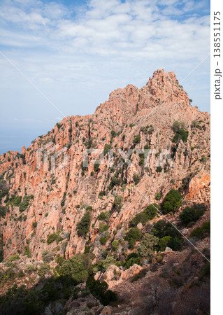 Red rocks are under cloudy sky on a summer day. Vertical landscape photography Red rocks are under cloudy sky on a summer day. Vertical landscape photography 138551175