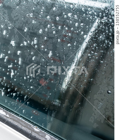 Drops on grey car surface after washing Drops on grey car surface after washing 138552755