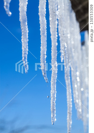 Long natural icicles on a sky background 138553309