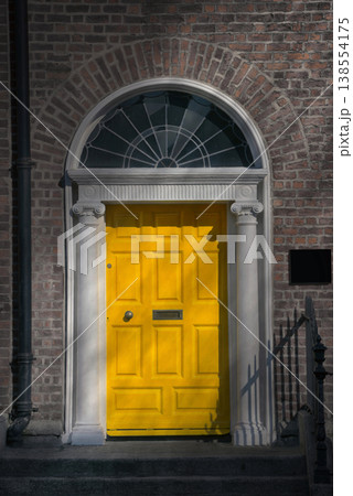 A Yellow Georgian door in Dublin Ireland A Yellow Georgian door in Dublin Ireland 138554175
