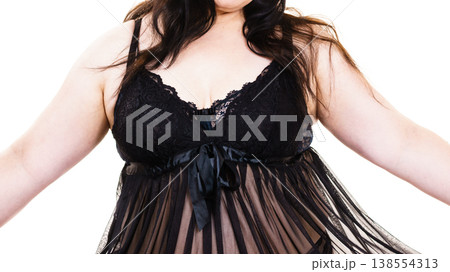 Woman in black lingerie showing her breast chest. Woman in black lingerie showing her breast chest. 138554313