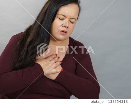 Adult woman having pain in chest Adult woman having pain in chest 138554318