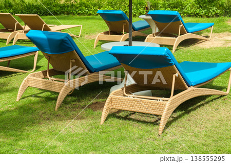 Chairs ready for people to relax in Bali near a pool 138555295