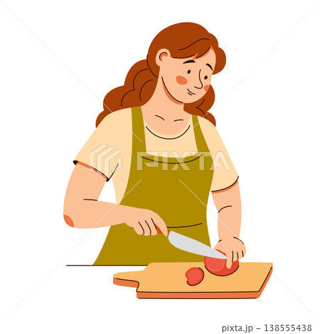 Smiling woman in apron slices a tomato on a board. A cozy home cooking scene featuring healthy food 138555438