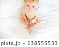 A small child in the hospital asks to be picked up by his mother 138555533