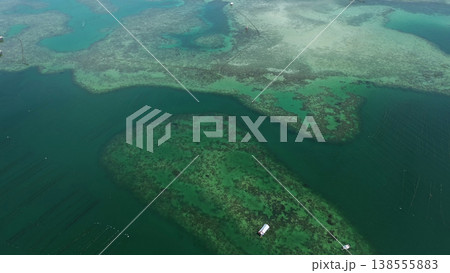 Coral reef and fish farm with cages for fish Coral reef and fish farm with cages for fish 138555883