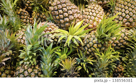 Ripe juicy pineapples at the market close-up 138556381