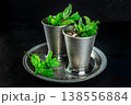 Mint Julep in the Kentucky Derby classic silver glass, with fresh mint leaves 138556884