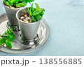 Mint Julep in the Kentucky Derby classic silver glass, with fresh mint leaves 138556885