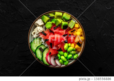 Vegan poke bowl with grapefruit, avocado, mango, edamame, and cucumber 138556886