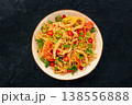 Chow Mein noodles with chicken and vegetables, overhead flat lay shot on black 138556888