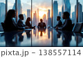 Photo of business meeting in a modern office with city view at sunset, diverse team, collaboration, corporate strategy, leadership, success, teamwork, professional environment 138557114