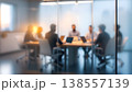 Photo of blurred business meeting in modern office behind glass wall, teamwork and collaboration concept 138557139