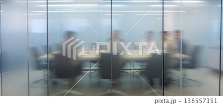 Photo of a blurred meeting room behind frosted glass, business meeting in progress, office interior, corporate environment, teamwork and collaboration concept Photo of a blurred meeting room behind frosted glass, business meeting in progress, office interior, corporate environment, teamwork and collaboration concept 138557151