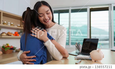 Mother embracing daughter in supportive moment 138557211