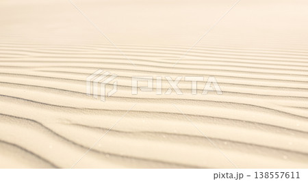 Beige sand texture with ripples for background, minimalist design, or nature concept Beige sand texture with ripples for background, minimalist design, or nature concept 138557611