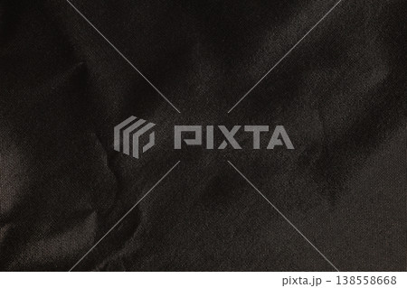 Glossly black crumpled fabric material texture Glossly black crumpled fabric material texture 138558668
