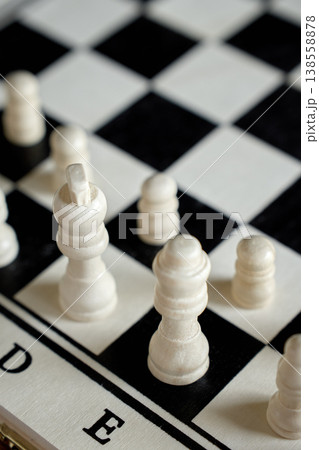 Close-up of white chess pieces on chessboard Close-up of white chess pieces on chessboard 138558878