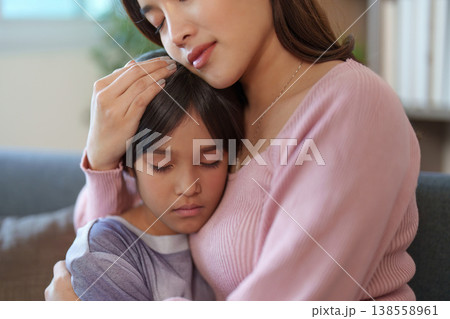 Mother embracing her child with love and care Mother embracing her child with love and care 138558961