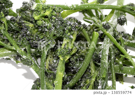 Close up of purple sprouted broccoli blanched on white background Close up of purple sprouted broccoli blanched on white background 138559774