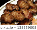 Close up of chipolatas pigs in blankets sausages wrapped in bacon on white background 138559808