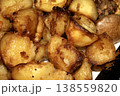 Close up of roasted vegetables crsipy potatoes side dish for Sunday roast dinner 138559820