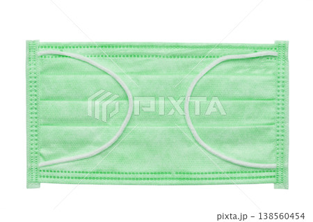 Protective green medical face mask isolated on white background.  138560454