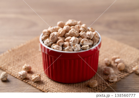 Organic raw chickpeas in a red bowl, healthy food ingredient Organic raw chickpeas in a red bowl, healthy food ingredient 138560777