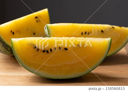 Sliced yellow watermelon on wooden background ready for eat, tropical fruit for summer season 138560813