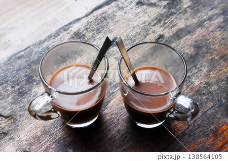 Top view of Two glass cup of hot coffee on wooden table for breakfast 138564105